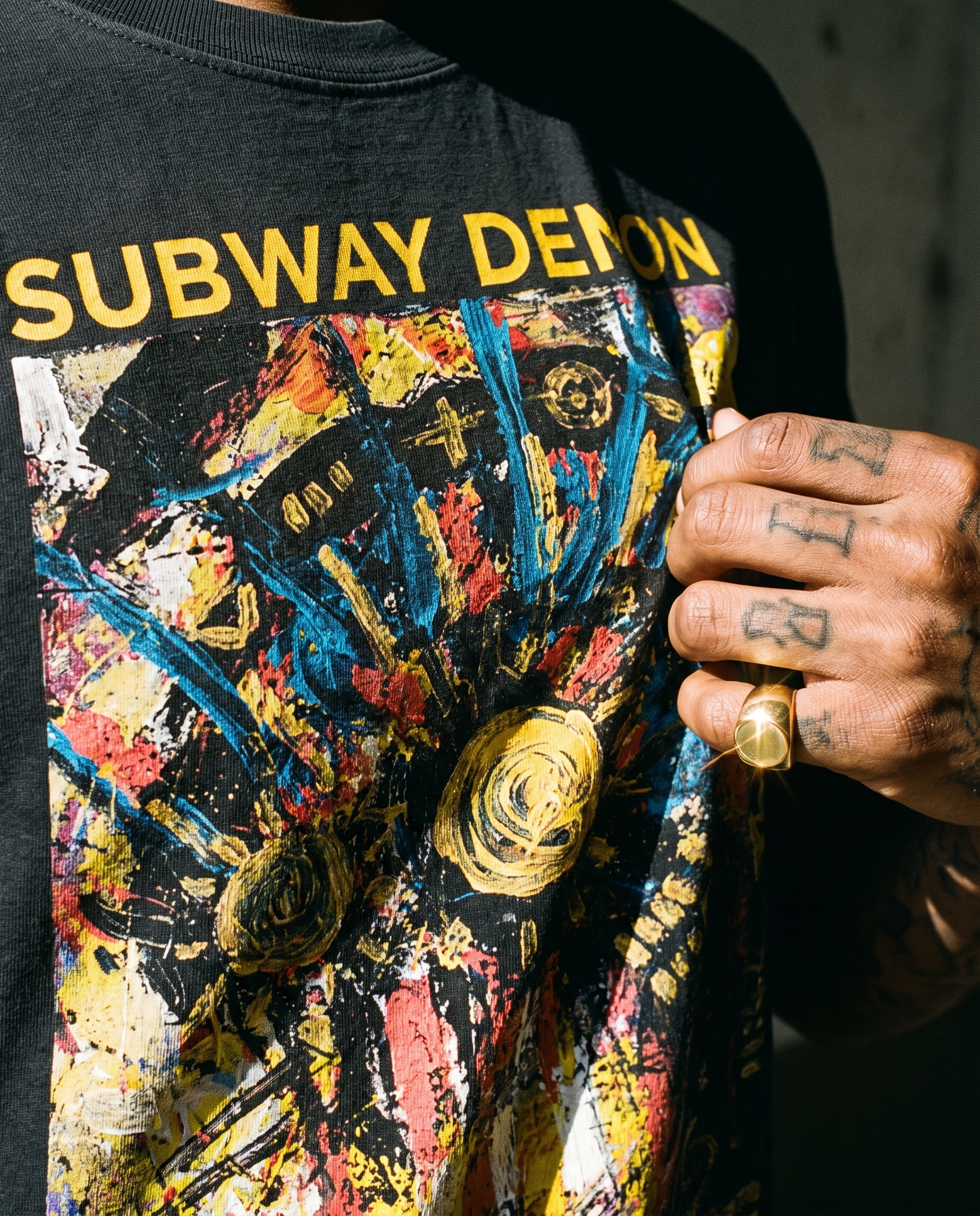 Detail shot of the Subway Demon Tee print and heavyweight cotton fabric