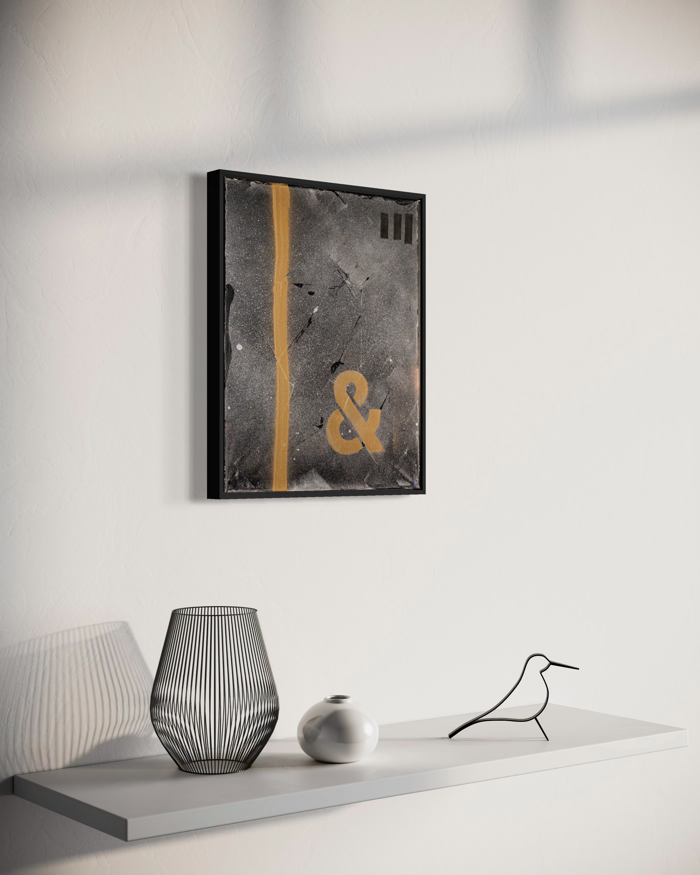 The Age of & - original painting by Youssef Lakhrif shown in room setting 1. Dark grey abstract featuring a glowing yellow ampersand.