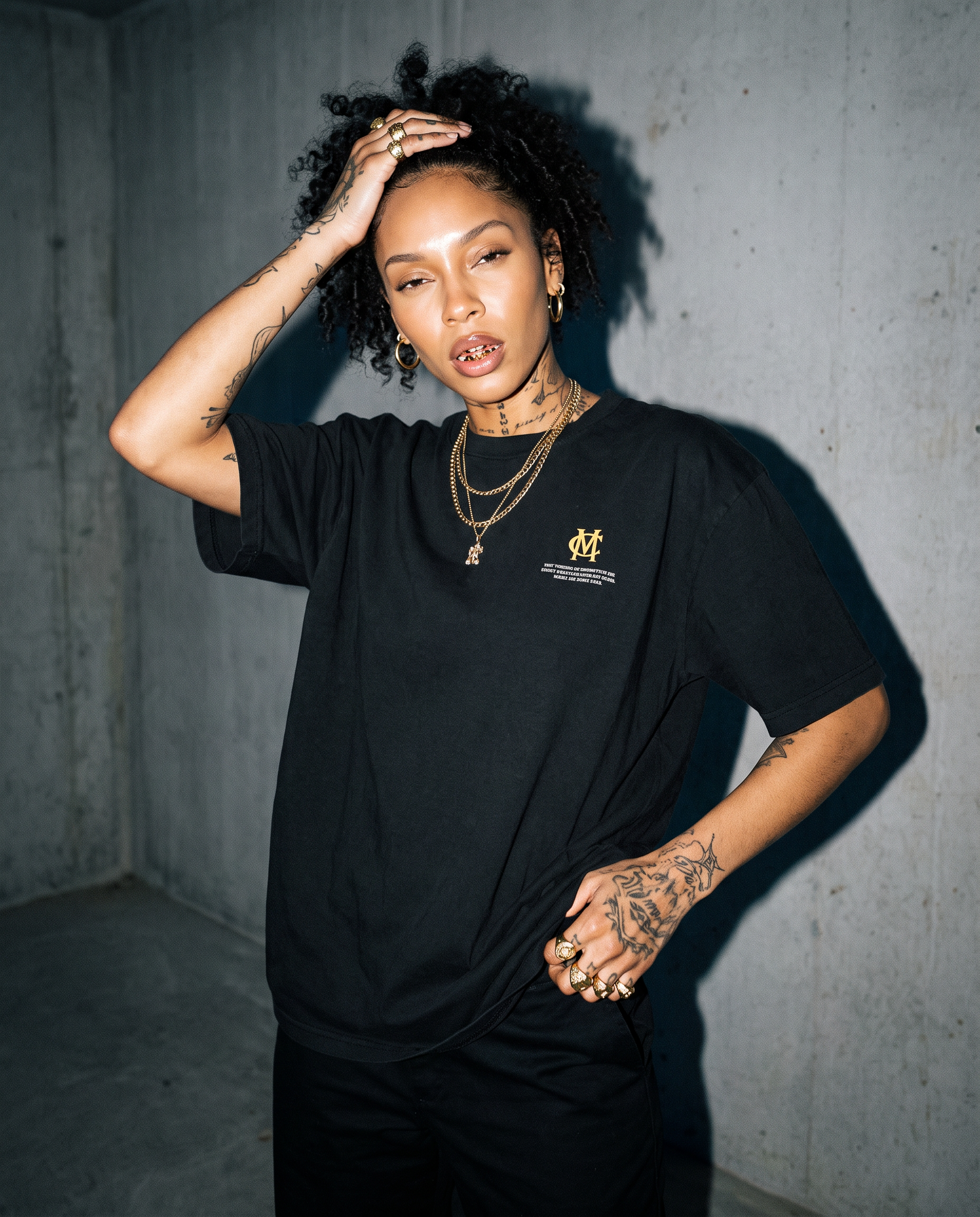 Front of the Subway Demon Tee worn, bare black cotton with the small printed chest label