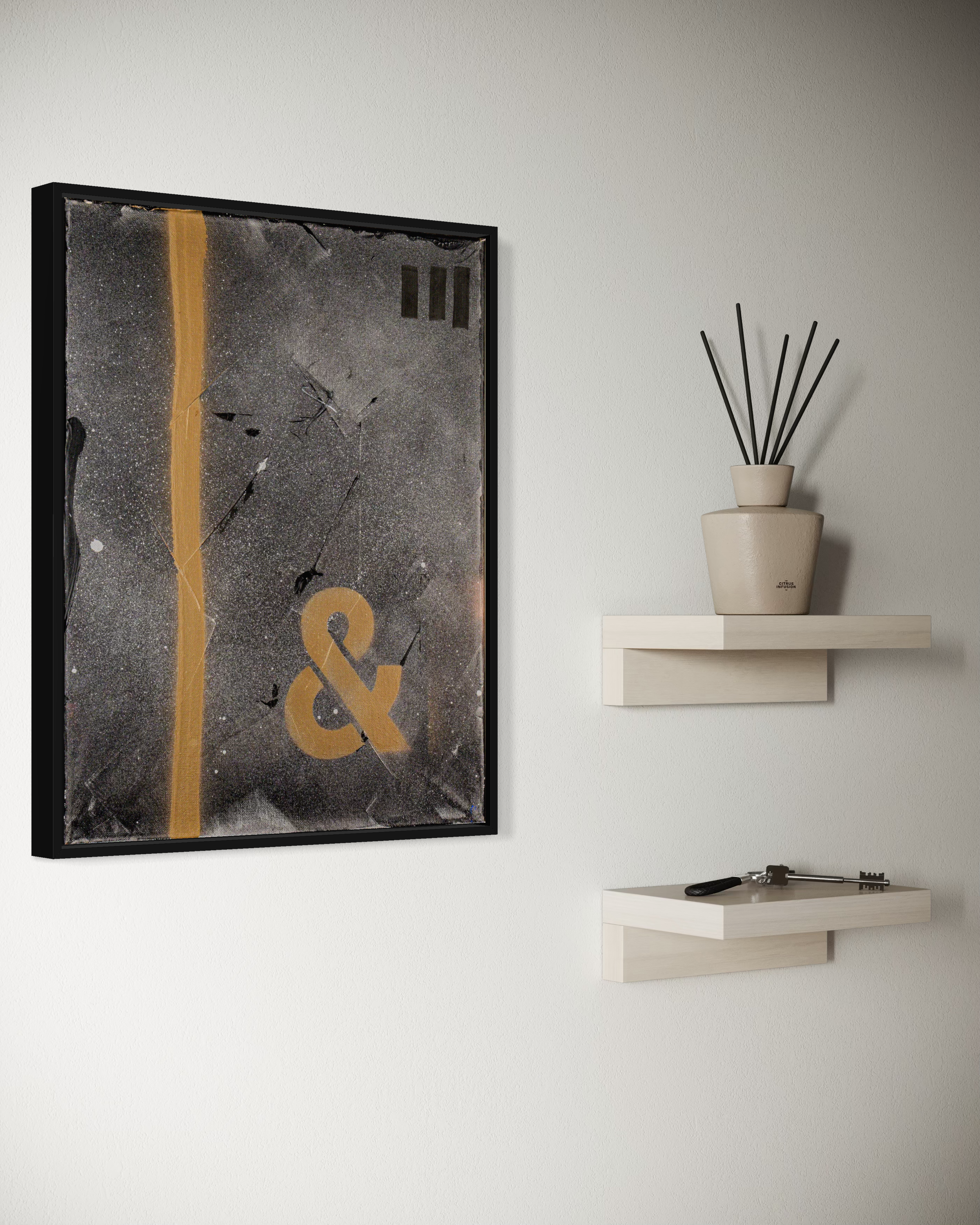 The Age of & - original painting by Youssef Lakhrif shown in room setting 2. Dark grey abstract featuring a glowing yellow ampersand.